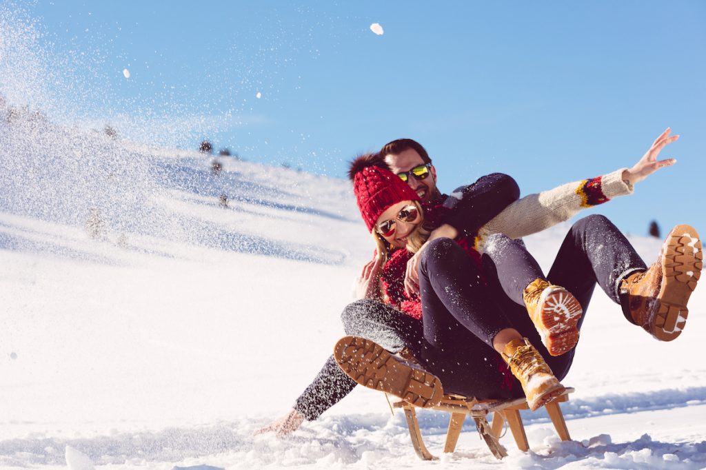 Couple Sledding