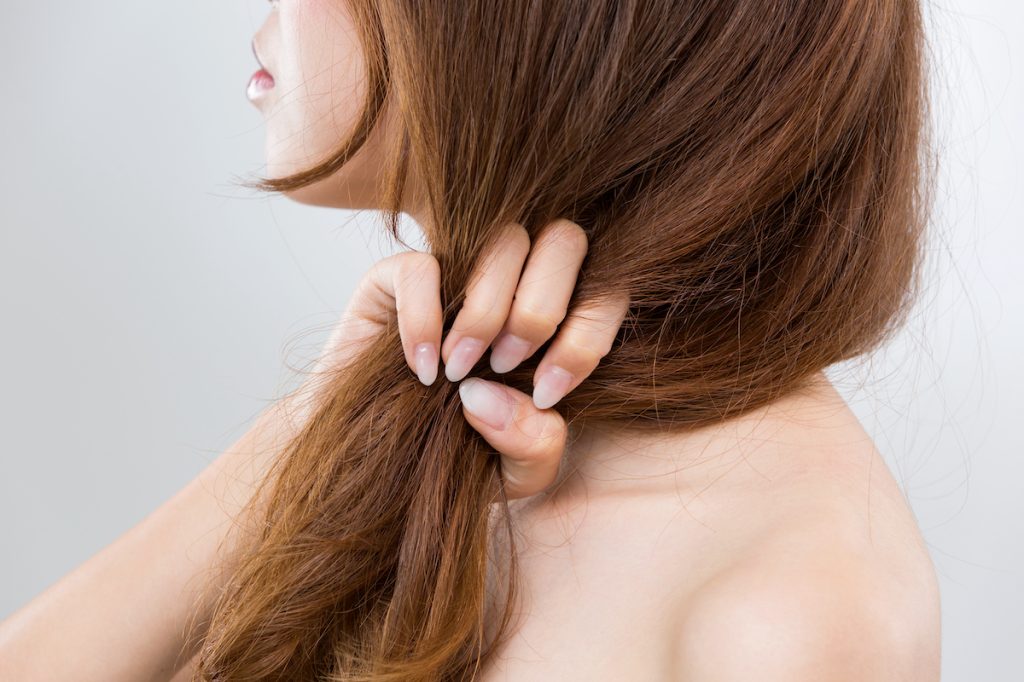 woman with dry damaged hair