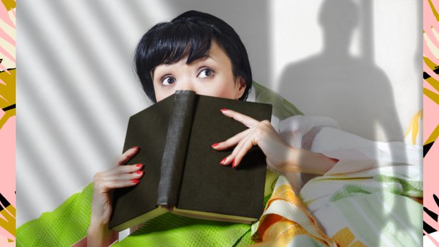 woman reading thriller book