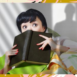 woman reading thriller book