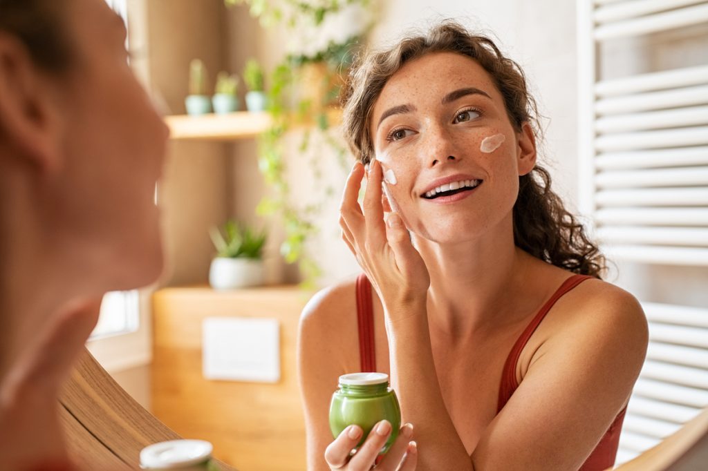 Woman Applying Moisturizer