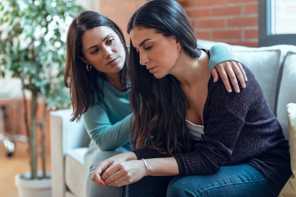 friends consoling sad