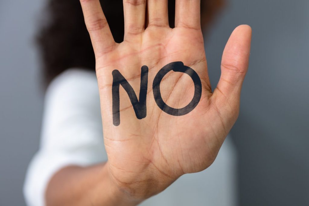 woman with word no on her hand