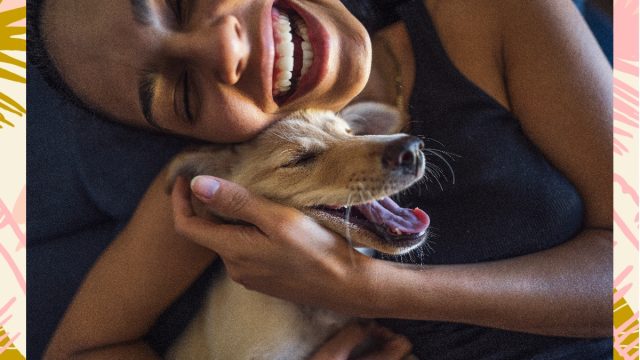 woman playing with dog