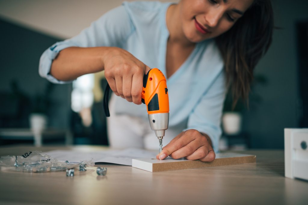 Woman Assembling Furniture