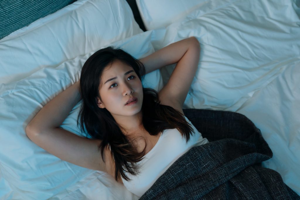 Woman in Bed Thinking